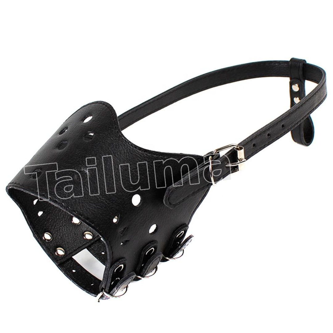 Black leather dog muzzle with ventilation holes and an adjustable strap.