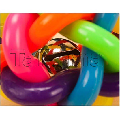 Close-up view of a multicolor rubber dog toy ball and small metal bell is visible inside the ball.